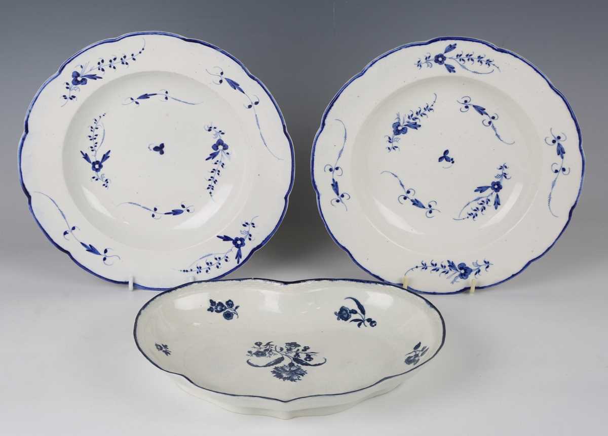 A pair of Caughley Chantilly Sprig pattern blue painted soup plates, circa 1790, impressed ‘