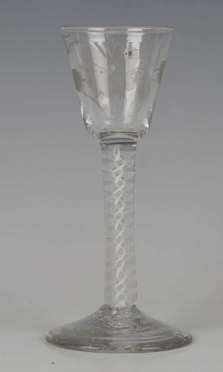 A pair of engraved double series opaque twist stem wine glasses, circa 1765, the rounded funnel - Image 2 of 5