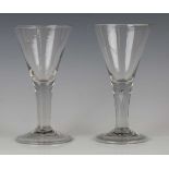 Two large plain stem wine glasses, circa 1740, each with drawn trumpet bowl and folded conical foot,