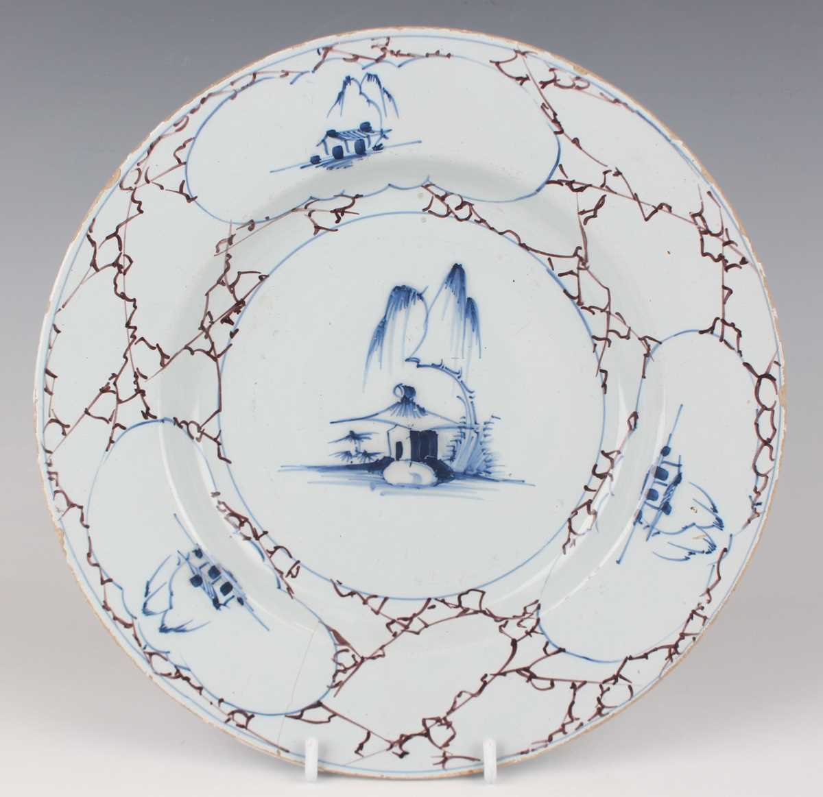 An English delft plate, Lambeth, circa 1770-85, painted in blue, green and manganese with a windmill - Image 15 of 23
