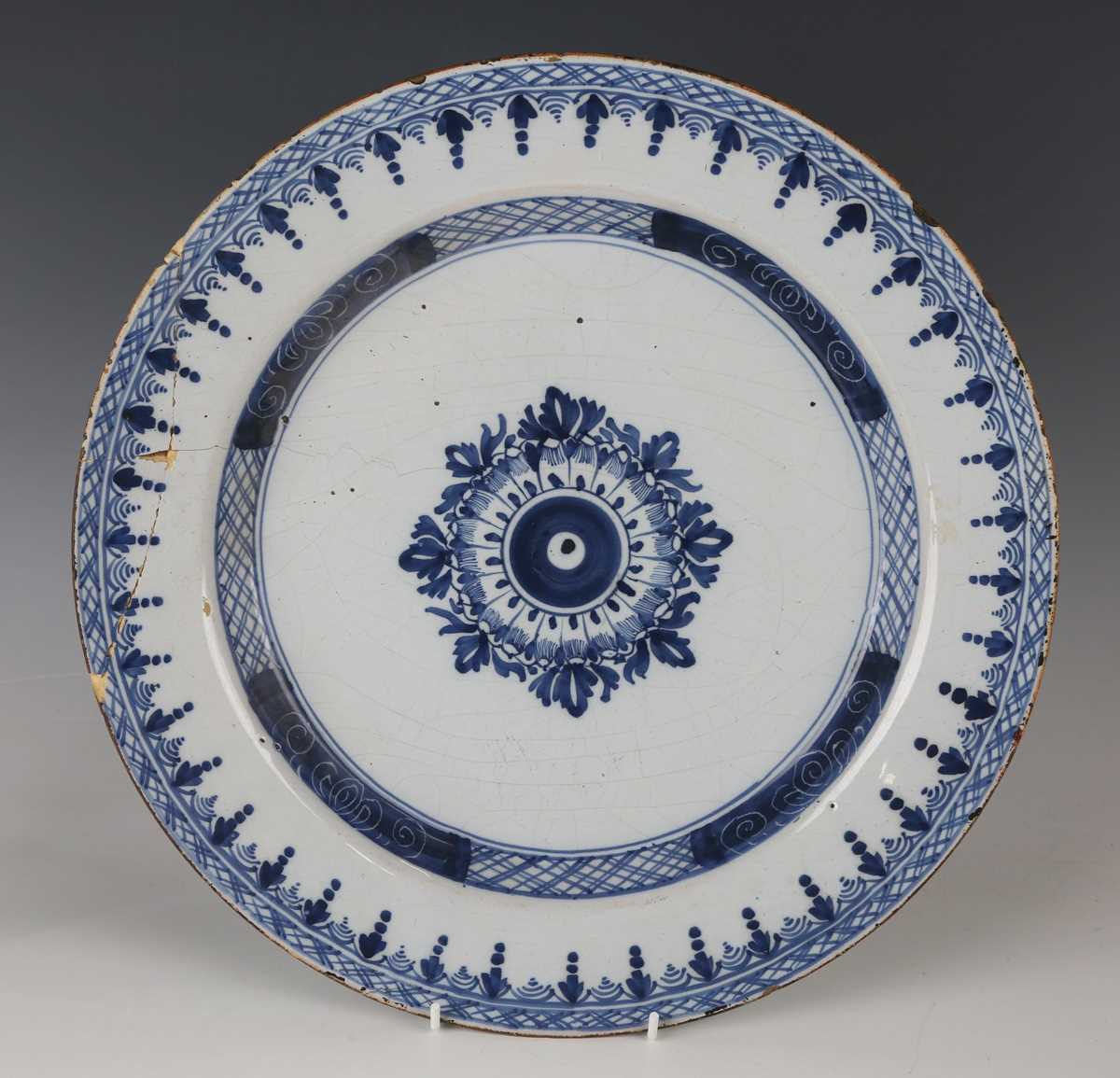 A manganese powdered ground delft dish, Bristol or Wincanton, circa 1740, painted in blue with a - Image 6 of 21