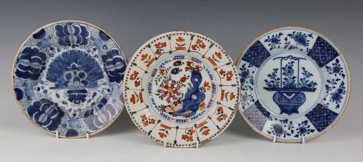 A Dutch delft Peacock pattern plate by De Porceleyne Claeuw, 18th century, painted in blue within an
