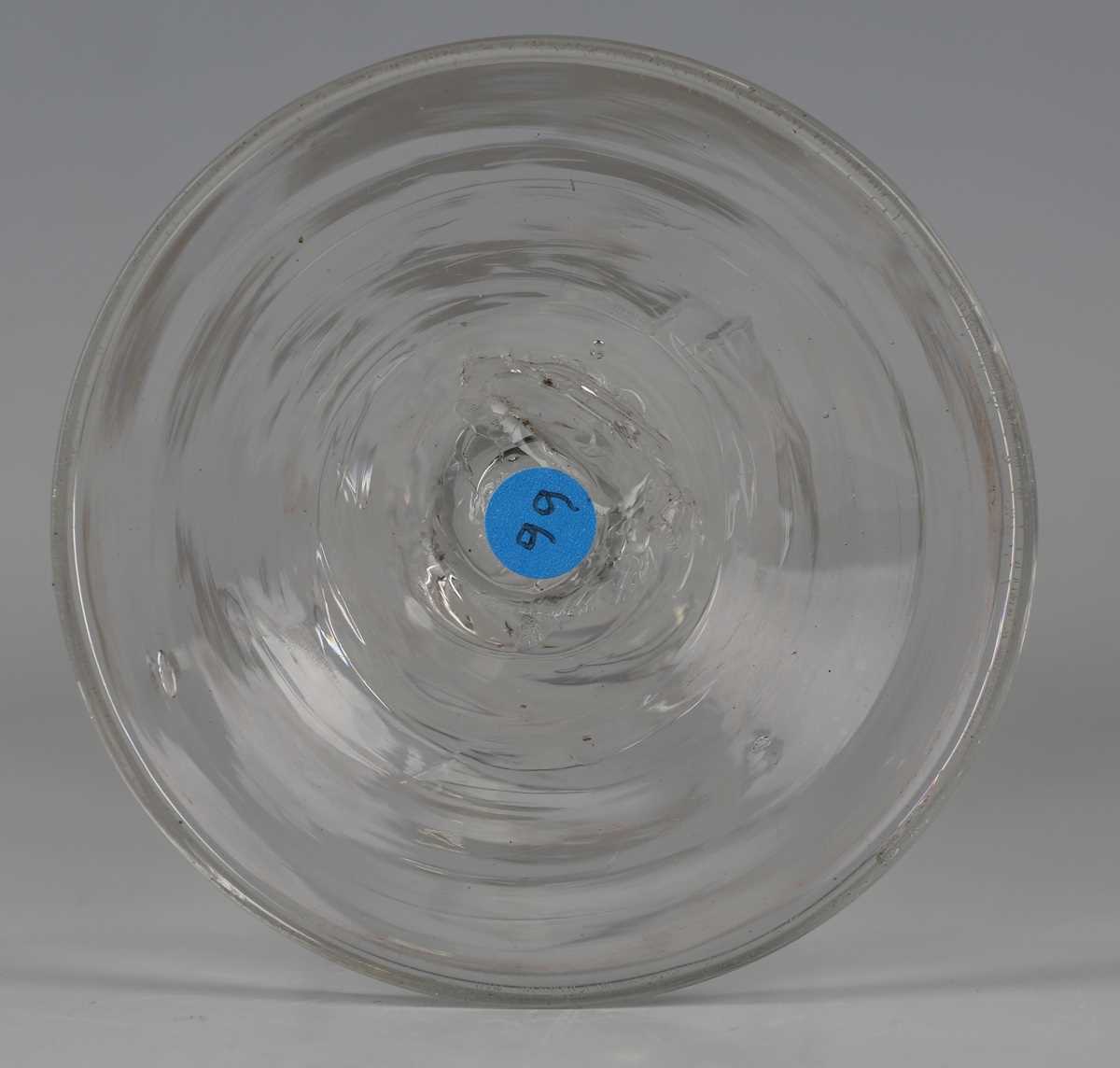A pair of engraved double series opaque twist stem wine glasses, circa 1765, the rounded funnel - Image 3 of 5