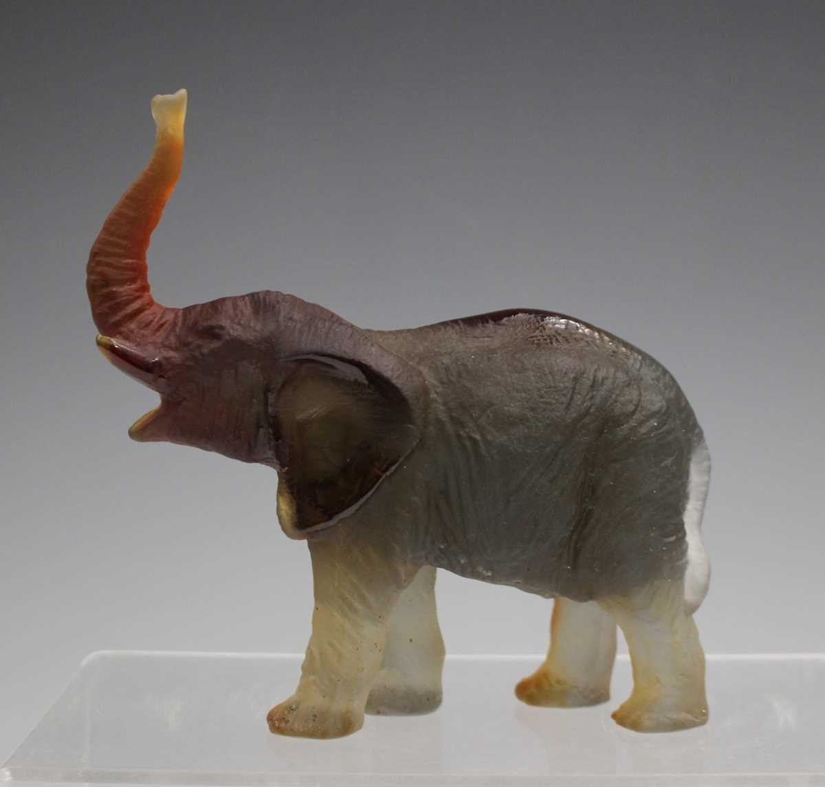 A Daum frosted amber glass model of an elephant with raised trunk, contemporary, designed by Jean- - Image 2 of 7