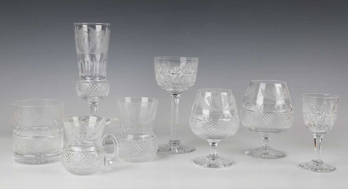 A part suite of Edinburgh Crystal Thistle pattern glass, comprising eight flutes, height 17.5cm, a