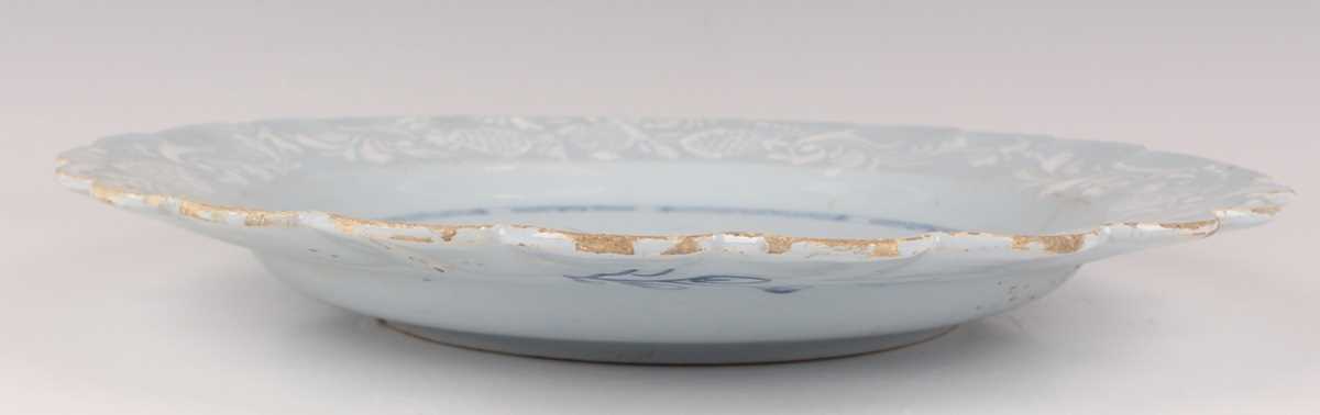 A manganese powdered ground delft dish, Bristol or Wincanton, circa 1740, painted in blue with a - Image 16 of 21
