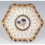 A Worcester hexagonal teapot stand, circa 1765, decorated in blue and gilt with a central flower