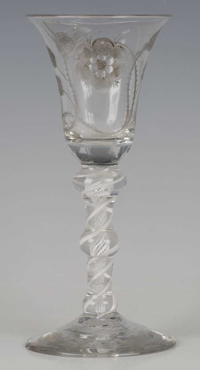 A double series opaque twist stem Jacobite type wine glass, circa 1770, the bell bowl engraved