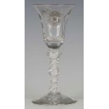 A double series opaque twist stem Jacobite type wine glass, circa 1770, the bell bowl engraved