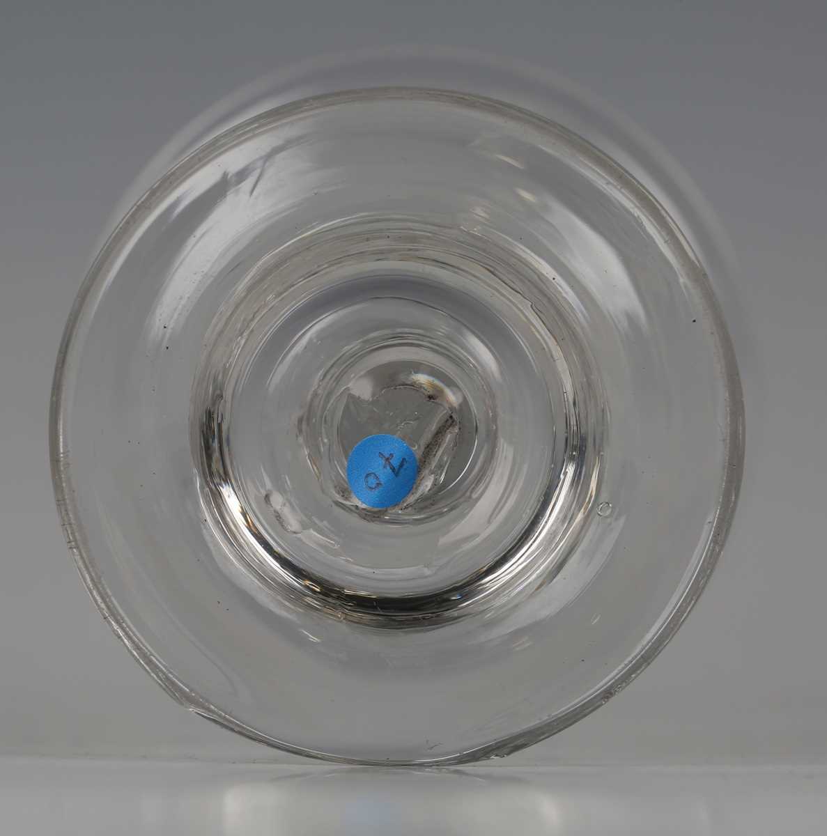 A light baluster stem sweetmeat glass, circa 1730-40, the everted lip ogee bowl above a beaded