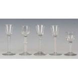 Five single series opaque twist stem wine glasses, circa 1760-70, including a plain stem example