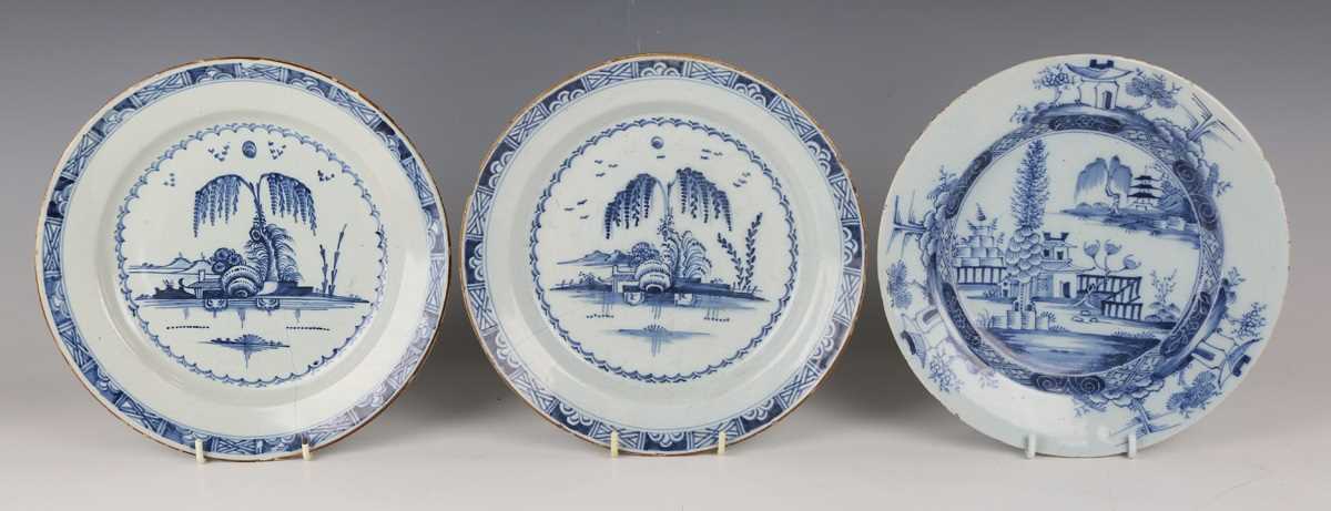 A matched pair of English delft plates, probably London, 1780s, painted in blue with a chinoiserie