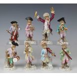Eight Volkstedt porcelain Meissen style monkey band figures, late 19th century, including a