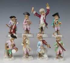 Eight Volkstedt porcelain Meissen style monkey band figures, late 19th century, including a