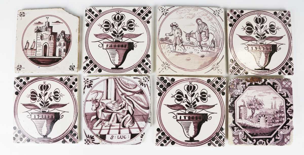 A set of four Dutch delft tiles, mid to late 18th century, each painted in manganese with a flower-