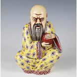 An unusual European pottery model of the Chinese god Shou Lao, in the style of Sarreguemines,