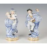 A pair of Meissen models of vintners, late 19th century, modelled after Acier, decorated in