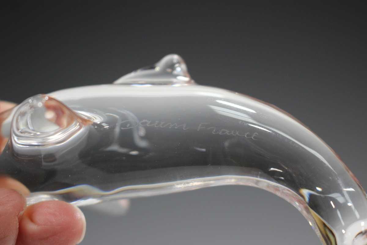A large Daum clear glass model of a dolphin, contemporary, its tail raised, engraved 'Daum France' - Image 3 of 3