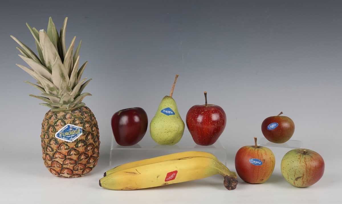 A small group of Penkridge Ceramics realistic pottery fruit, comprising a pineapple, height 28cm,