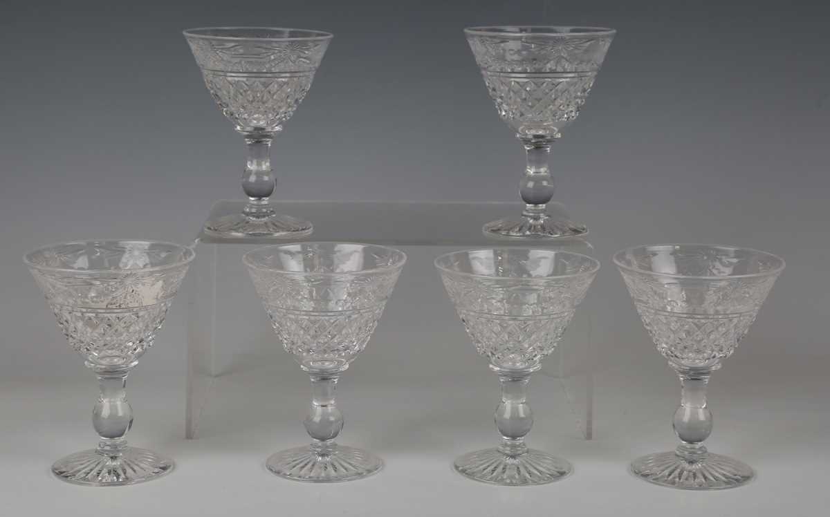 A set of seven hollow stem wine glasses, late 19th/early 20th century, the rounded funnel bowls - Image 3 of 5