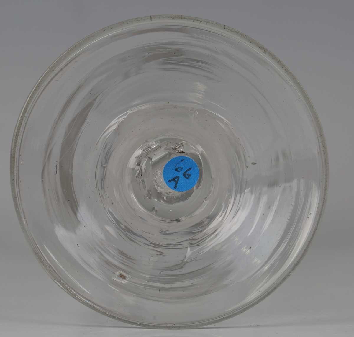 A pair of engraved double series opaque twist stem wine glasses, circa 1765, the rounded funnel - Image 5 of 5