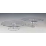 A pair of William Yeoward Crystal glass cake stands or centrepieces, the circular tops raised on