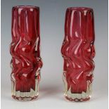 Two Czechoslovakian glass Brain vases, designed by Pavel Hlava in 1968, both of cranberry tint cased