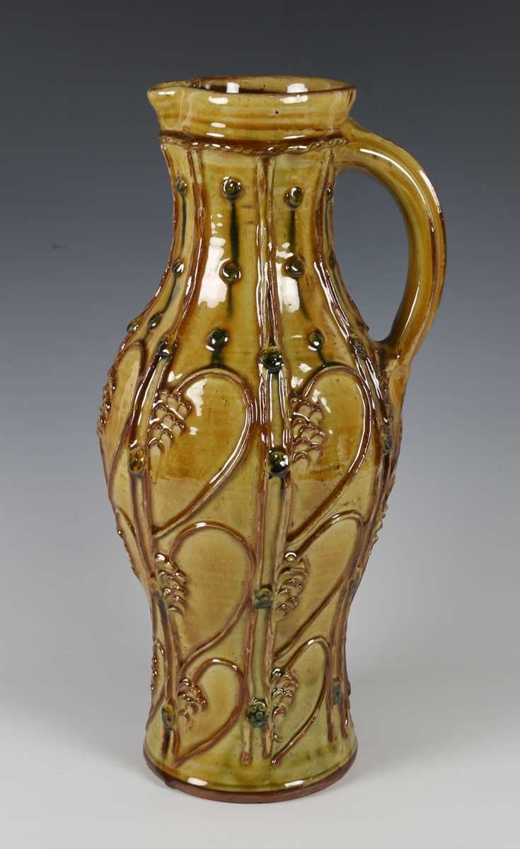 A large Doug Fitch studio pottery jug, the ochre glazed pear shaped body with appliqué medieval - Image 3 of 6