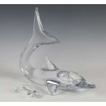 A large Daum clear glass model of a dolphin, contemporary, its tail raised, engraved 'Daum France'