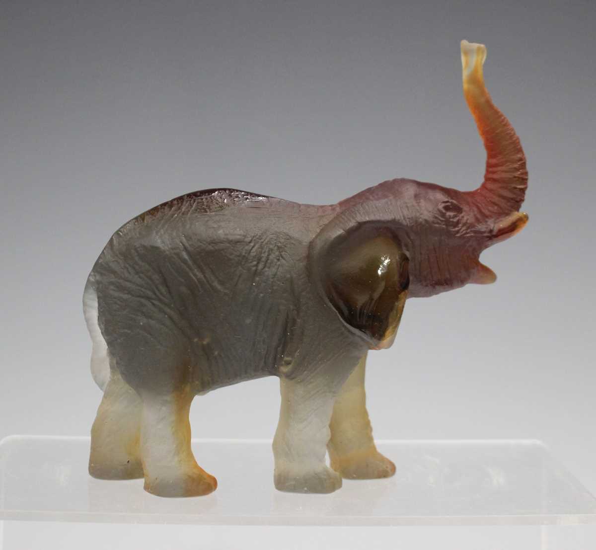 A Daum frosted amber glass model of an elephant with raised trunk, contemporary, designed by Jean- - Image 3 of 7