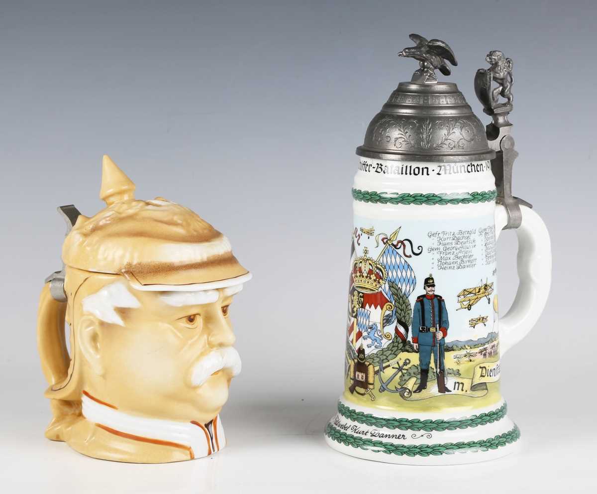 A German porcelain stein, modelled as the head of Otto von Bismarck, the hinged lid in the form of a