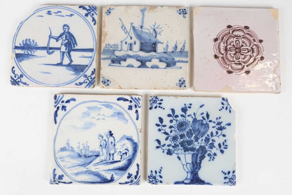 A London delft tile, circa 1740, painted in blue with an urn or vase of flowers, the corners with