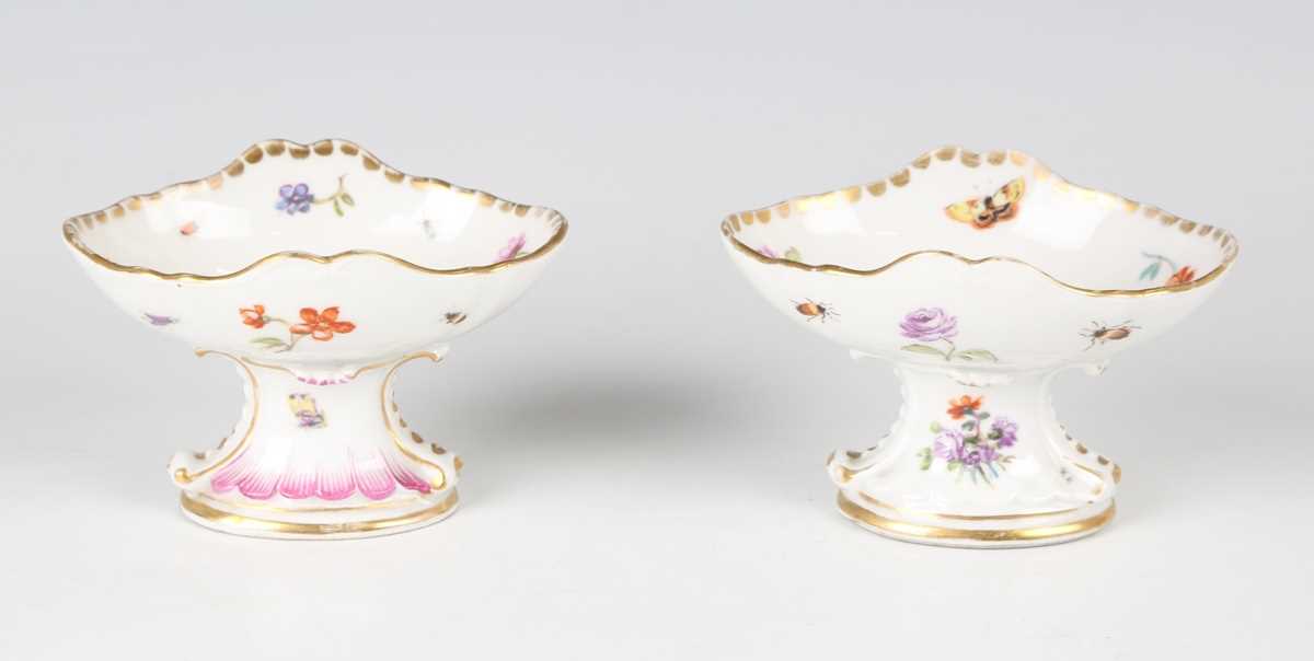 A matched pair of Dresden porcelain Meissen style salts, early 20th century, the oval dish tops