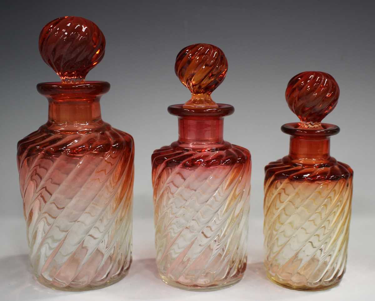 A graduated set of three Baccarat amberina glass scent bottles and stoppers, early 20th century, - Image 2 of 5