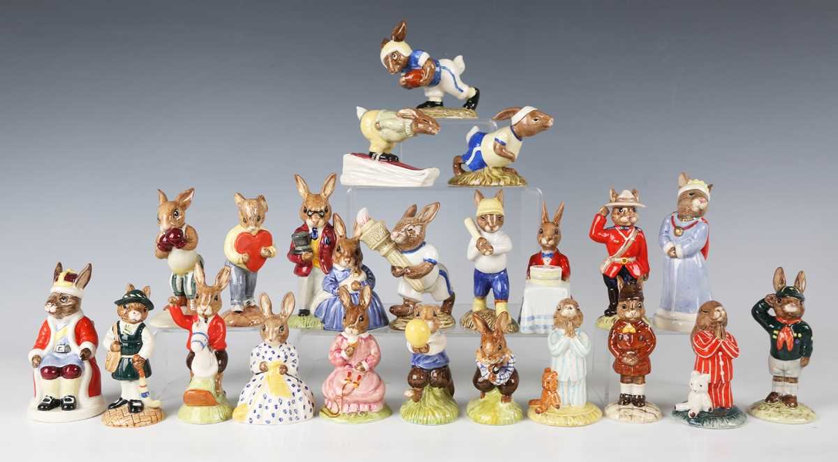 Twenty-two Royal Doulton Bunnykins figures, including Queen Sophie and King John from the