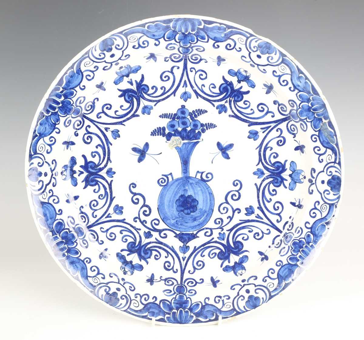 A set of four Dutch delft plates, late18th/19th century, each painted in blue with a central 'tea - Image 14 of 19