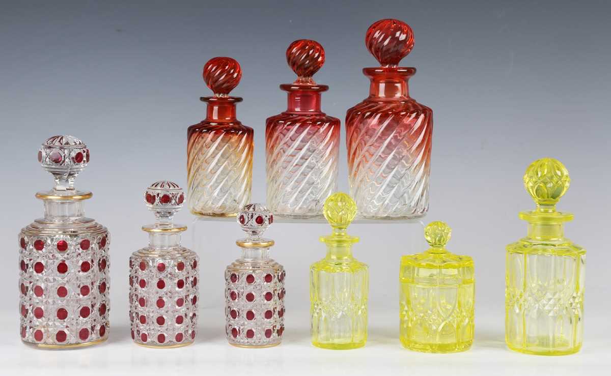 A graduated set of three Baccarat amberina glass scent bottles and stoppers, early 20th century,