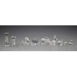 A small group of Swarovski Crystal glass animals, including hedgehog, crown wearing frog, mouse, two