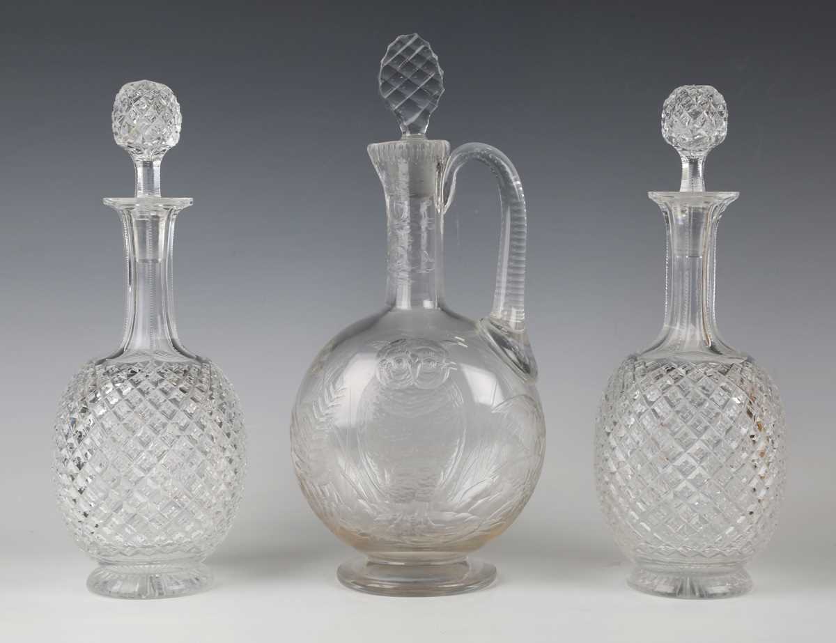 A pair of decanters and stoppers, early 20th century, each with an overall strawberry diamond