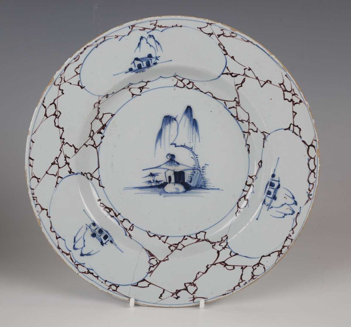 An English delft plate, Lambeth, circa 1770-85, painted in blue, green and manganese with a windmill - Image 2 of 23