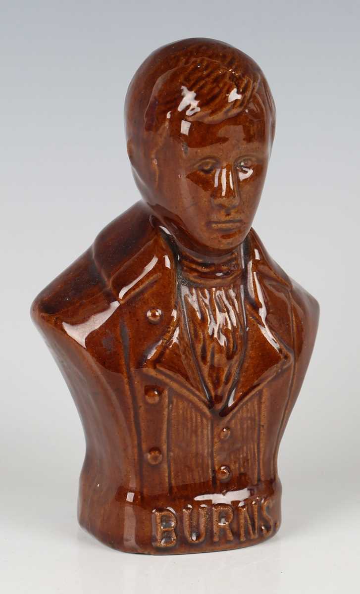 A brown glazed pottery money box, 19th century, modelled as a half-length titled bust of Robert