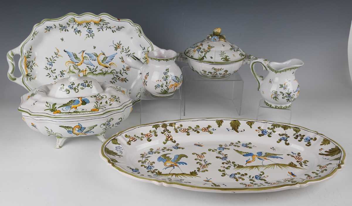 A Moustiers French faience part service, 20th century, painted with an exotic bird amidst flowers - Image 3 of 12