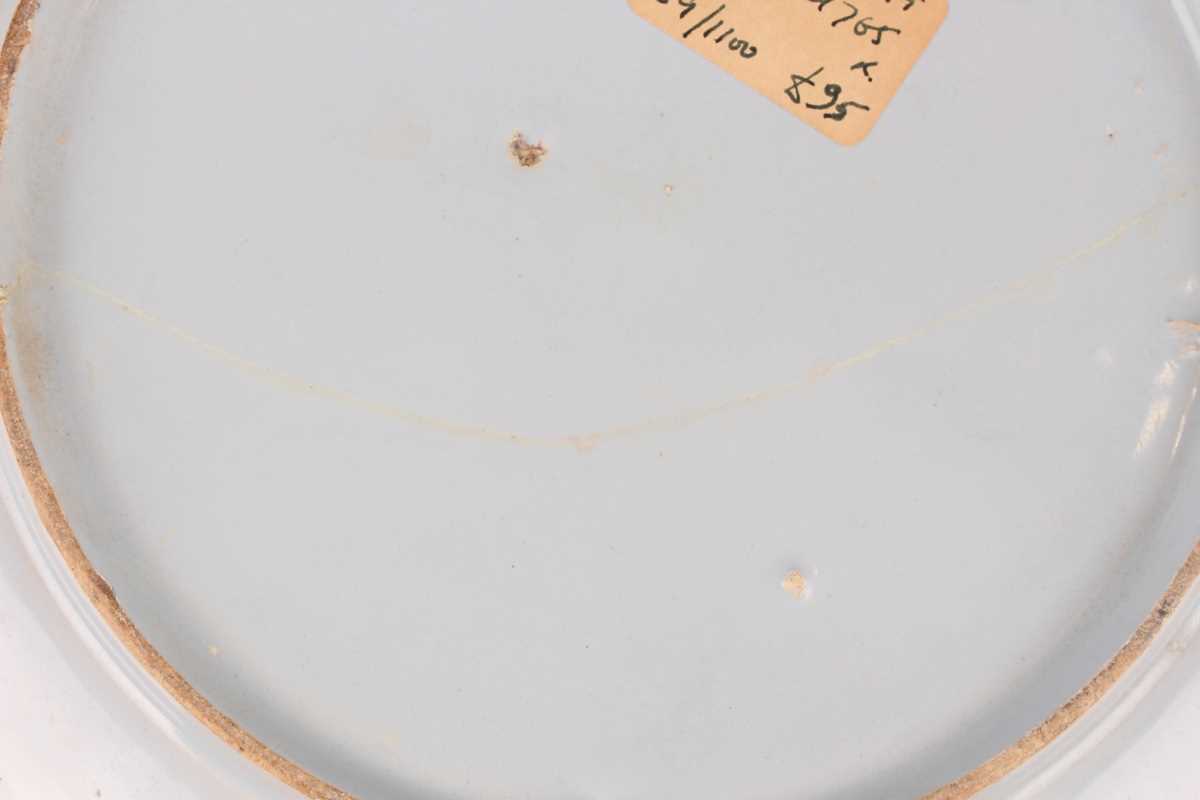 A manganese powdered ground delft dish, Bristol or Wincanton, circa 1740, painted in blue with a - Image 19 of 21