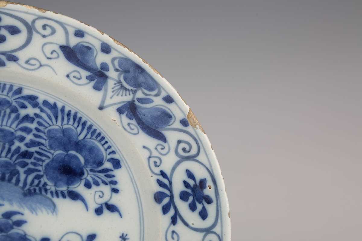 A set of four Dutch delft plates, late18th/19th century, each painted in blue with a central 'tea - Image 10 of 19