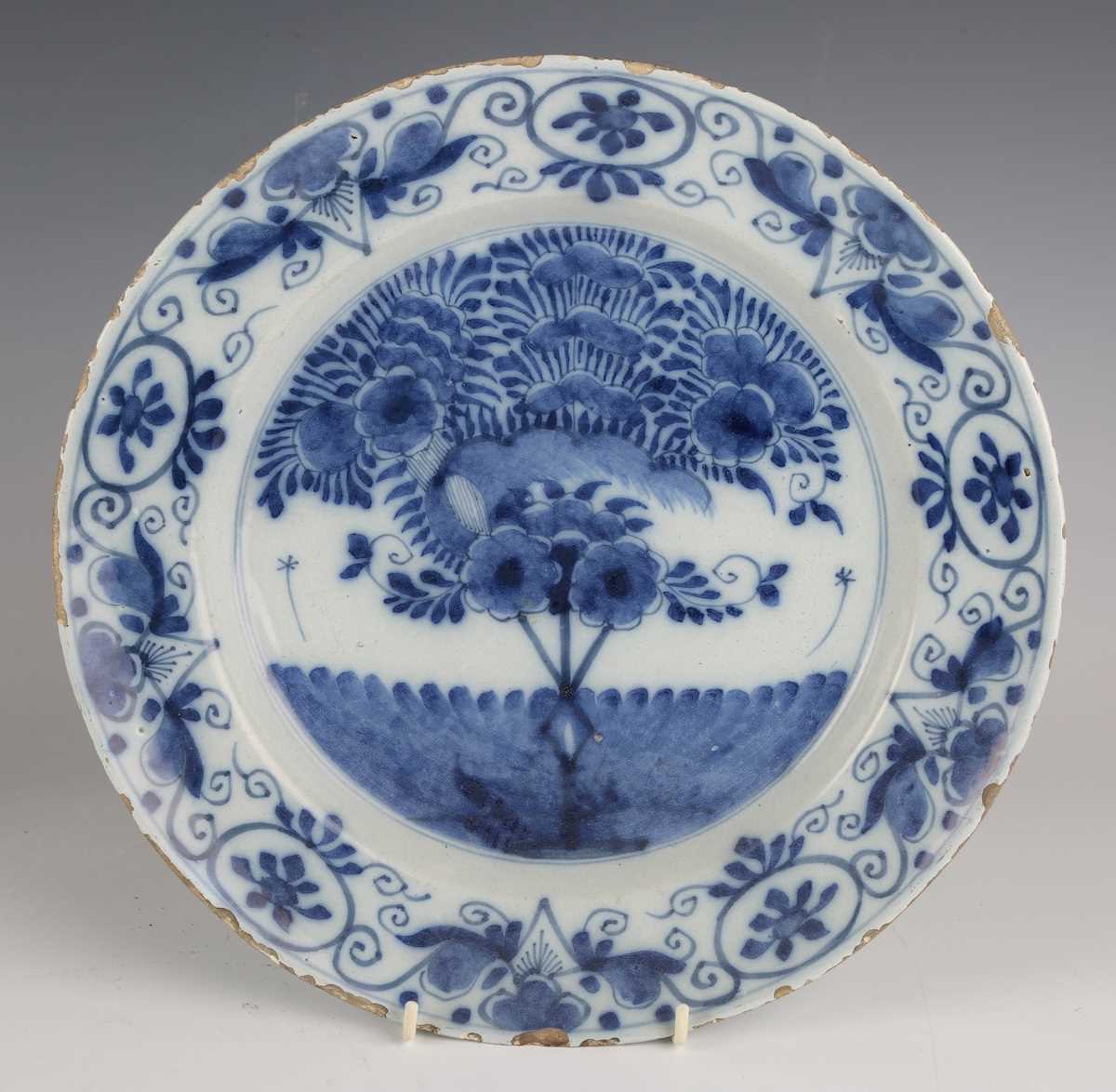 A set of four Dutch delft plates, late18th/19th century, each painted in blue with a central 'tea - Image 9 of 19