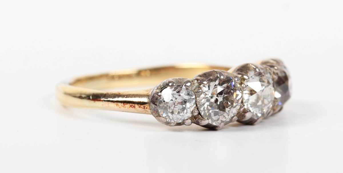 A gold, silver set and diamond five stone ring, mounted with a graduated row of old European cut