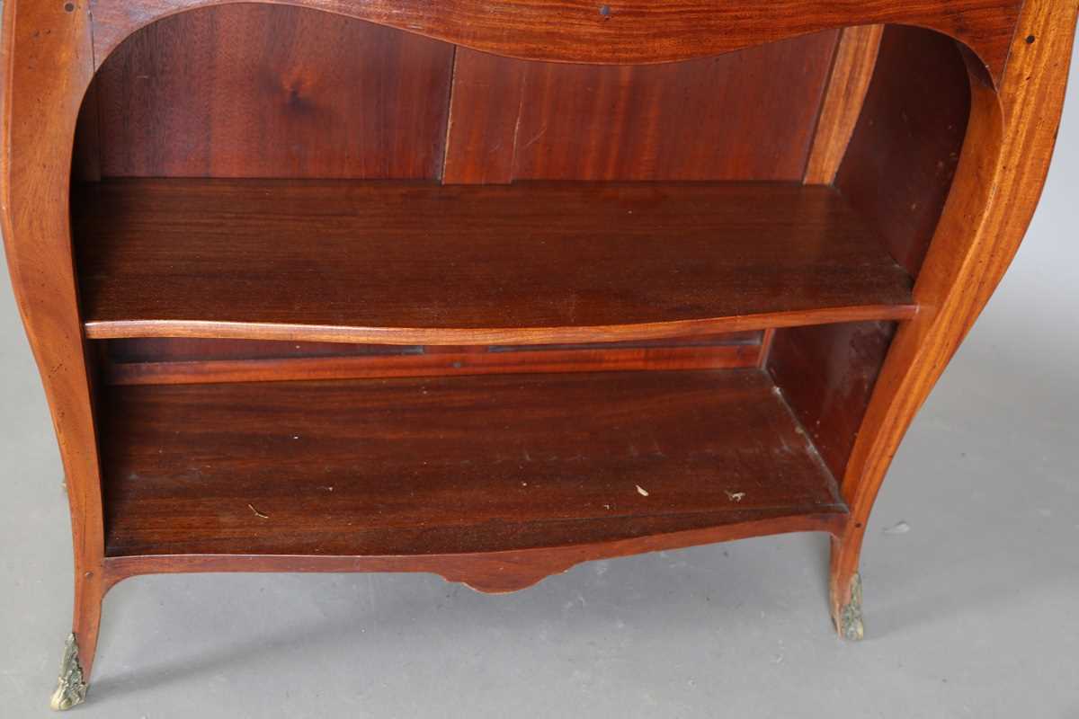 A 20th century hardwood bowfront open bookcase of bombé form, fitted with two drawers and a single - Image 4 of 8