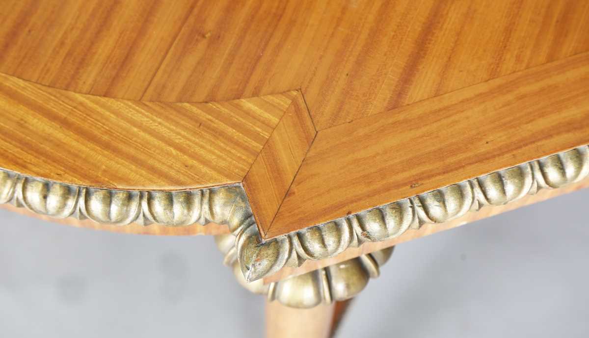 An early 20th century satinwood and gilt centre table, the quarter-veneered top on turned tapering - Image 3 of 6