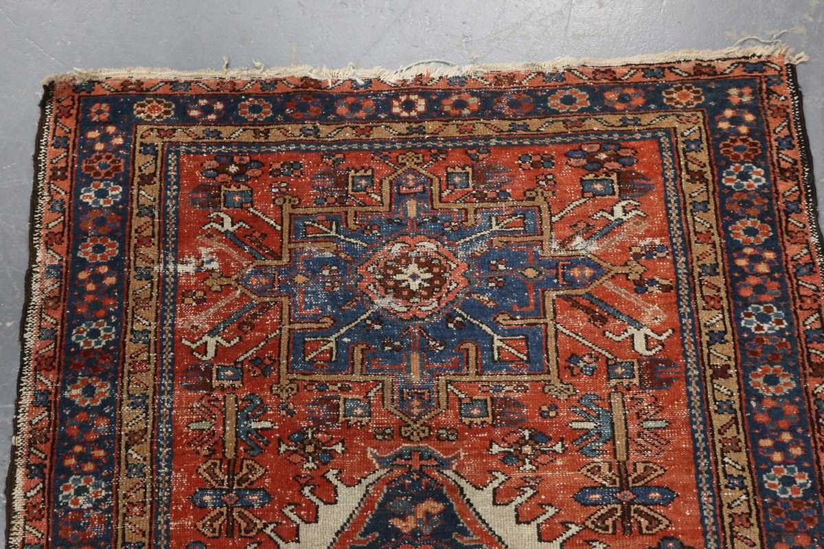 A small Heriz rug, North-west Persia, early 20th century, the terracotta field with three bold - Image 2 of 5