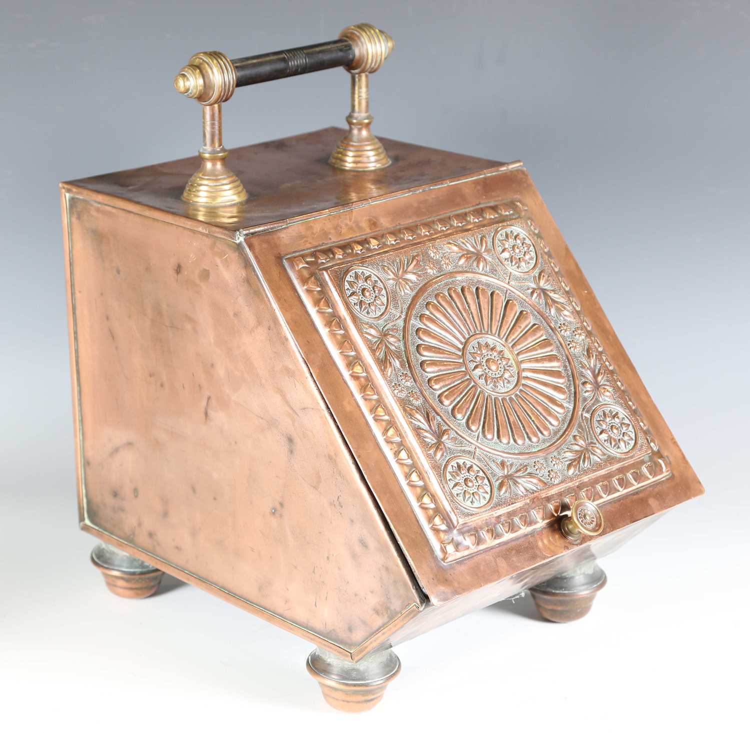 A late Victorian Aesthetic Movement copper coal scuttle, in the manner of Christopher Dresser, width